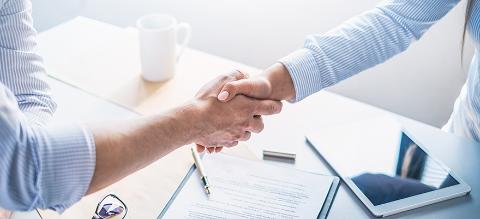 Business people shaking hands, finishing up meeting.