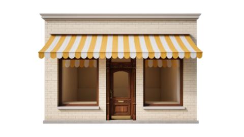 Isolated traditional shop facade with yellow striped awning, classic wooden door, and large windows.