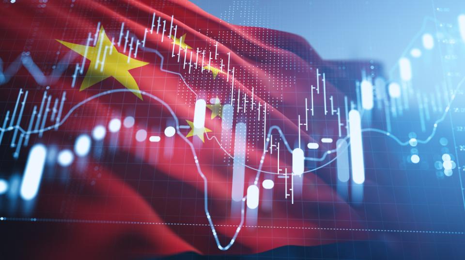 China stock market and forex exchange concept with candlestick chart and trading graph on financial background of Chinese flag and blue interface.
