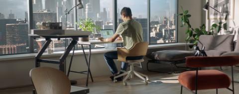 WIDE Caucasian male architect or student working on a private house model
